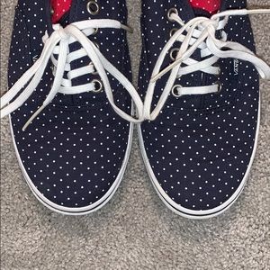 Navy blue polka dot low top vans